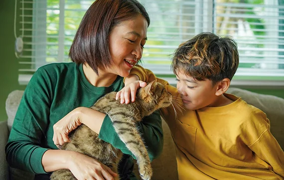 Mother and son with their pet cat
