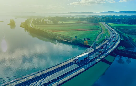 Truck driving over bridge