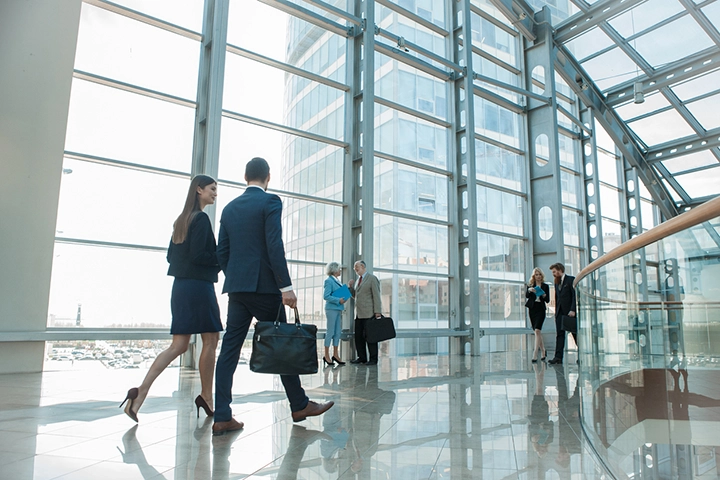 People walking in a building protected by construction sealants